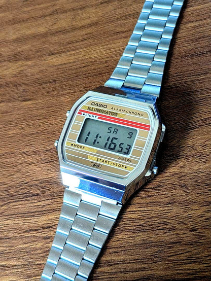 Casio A168WEHA-9AEF digital watch in gold tone with black digital display and original packaging