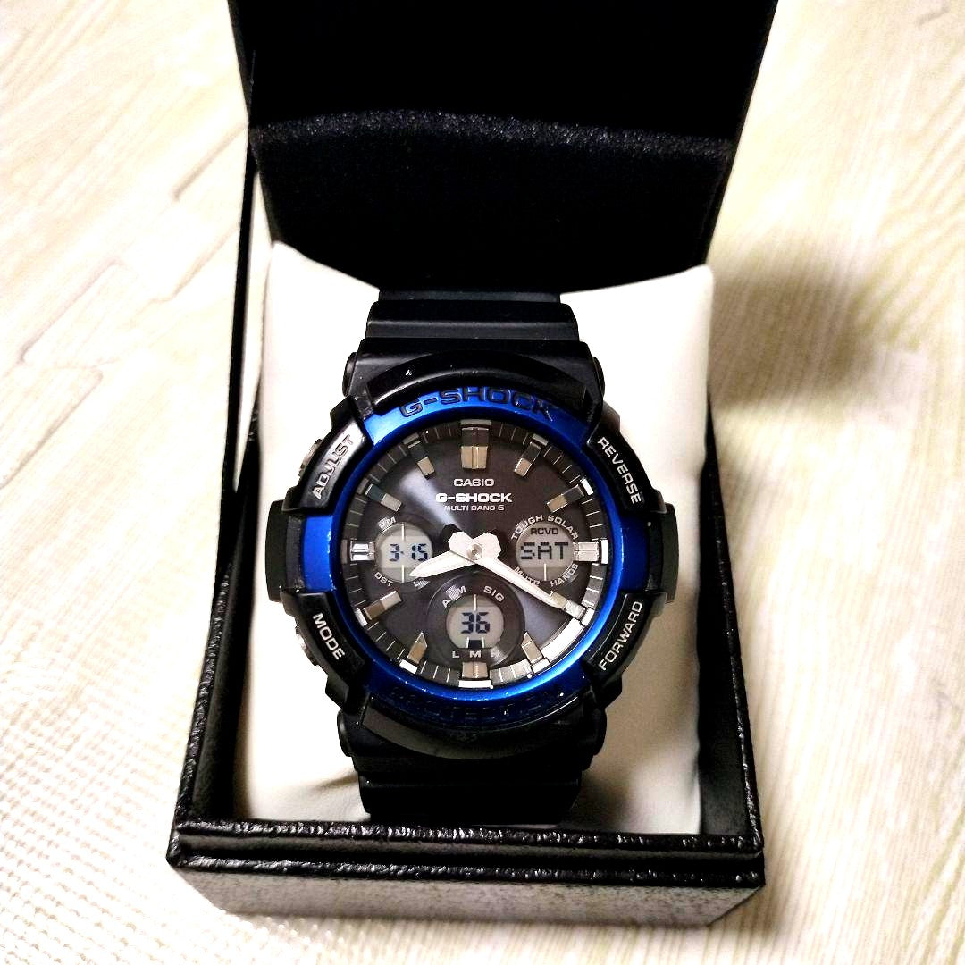 Casio G-Shock GAW-100B-1A2JF Radio Solar Watch in black and blue with rubber band and box