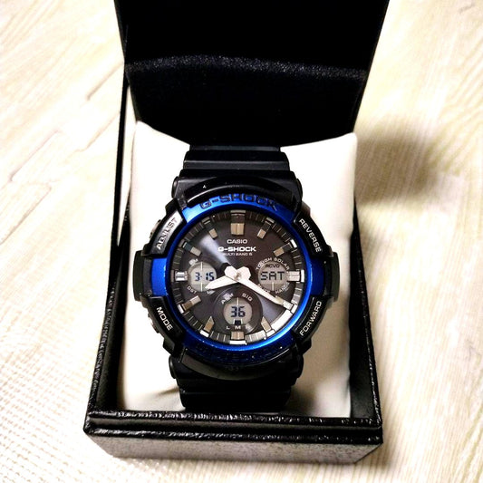 Casio G-Shock GAW-100B-1A2JF Radio Solar Watch in black and blue with rubber band and box