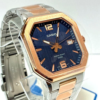 Casio MTP-B195RG watch with rose gold case and navy strap on white background