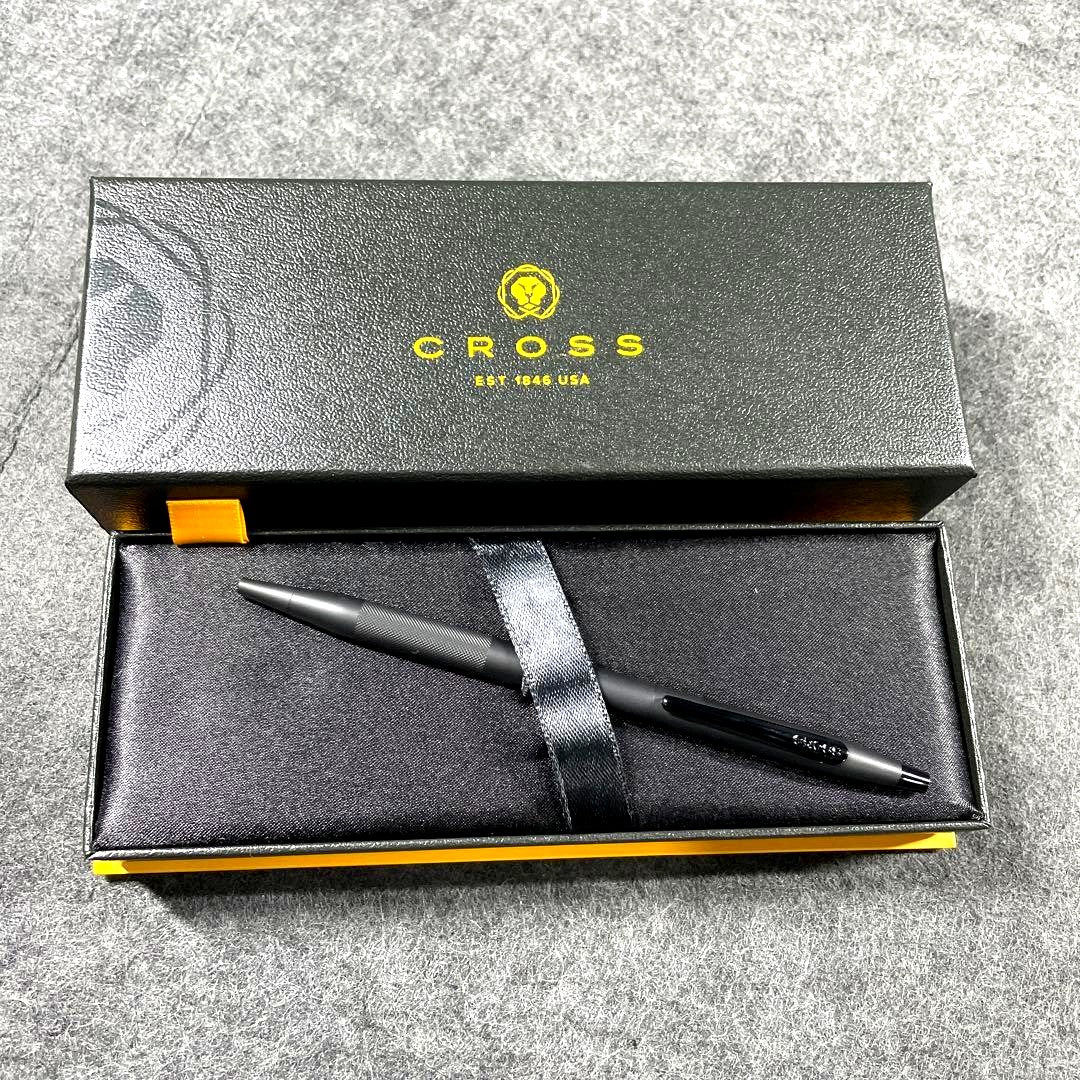Cross black ballpoint pen with box showing signs of use and scratches on exterior