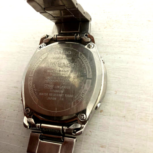 Casio Lineage LIW-T100T men's radio solar watch with black dial and stainless steel band showing slight wear