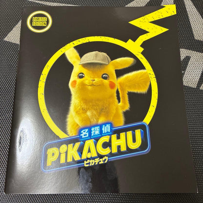 Limited Edition Nintendo Detective Pikachu pamphlet with neon cityscape artwork featuring Pikachu and Mewtwo