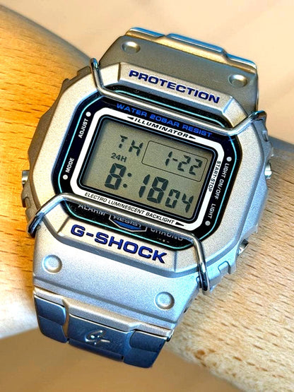 Casio G-Shock Speed DW-5000D unisex watch with silver mirror case and metal band, no box