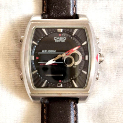 Casio Edifice 4334 watch with square black dial and brown leather strap on white background