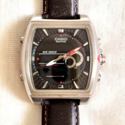 Casio Edifice 4334 watch with square black dial and brown leather strap on white background