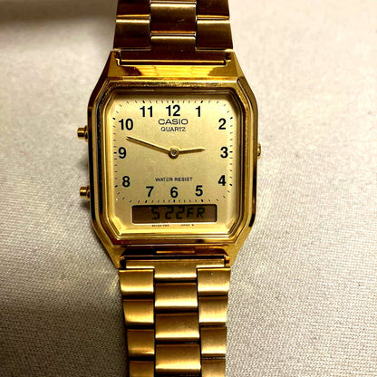 Casio Quartz Watch in gold color with digital and analog display and water resistant design