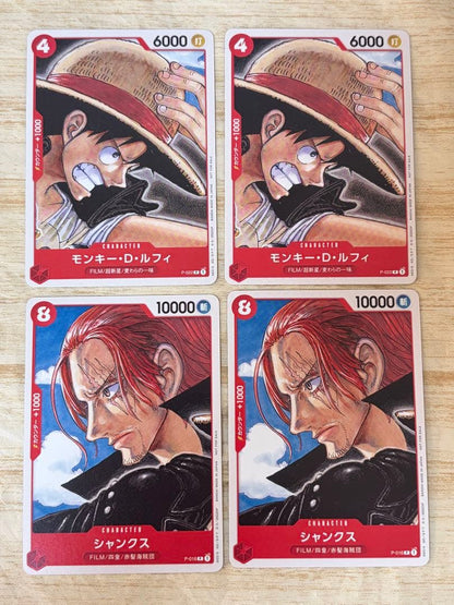 Set of four Japanese playing cards featuring Monkey D. Luffy P-022 and Shanks P-016 characters