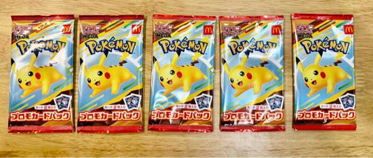 Set of five unopened Pokemon promo card packs from McDonald's Happy Meal showing Pikachu design