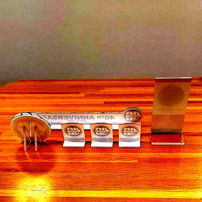Casio G-Shock 40th Anniversary 6-piece unused display sign set including W300 plate, acrylic logo, and mini easels