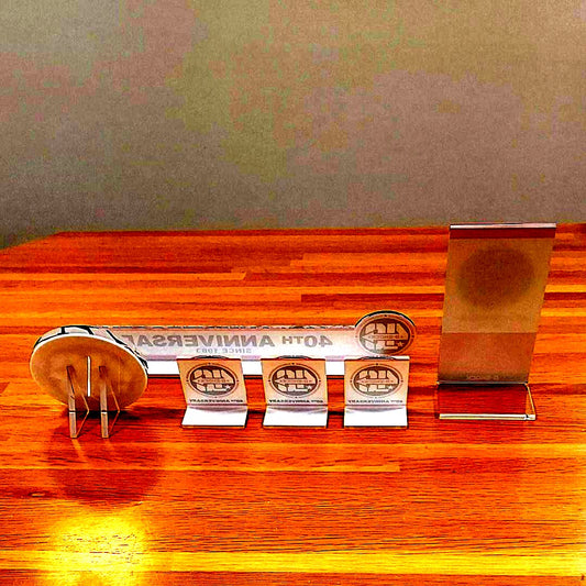 Casio G-Shock 40th Anniversary 6-piece unused display sign set including W300 plate, acrylic logo, and mini easels