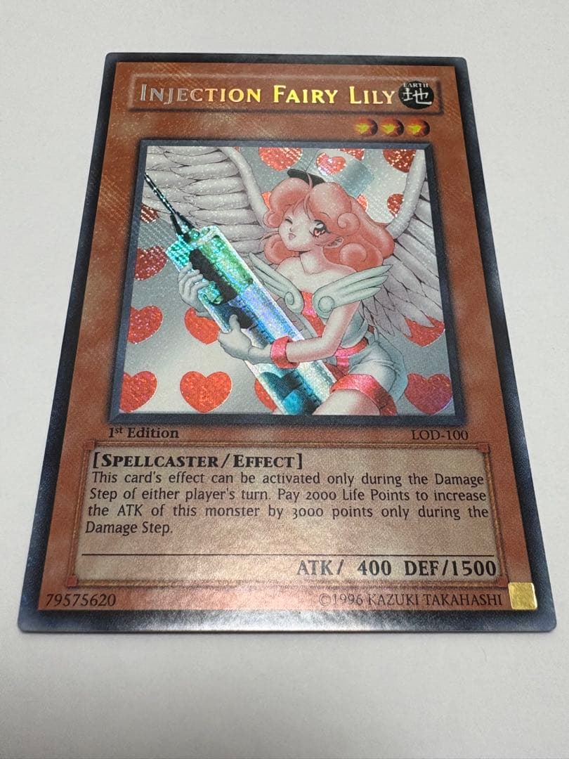 Bandai Yugioh Injection Angel Lily Old Asia Secret 1st edition Yu-Gi-Oh! card with visible back scuffs