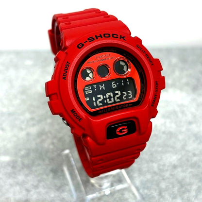 Casio G-Shock DW-6900RRB watch with vivid red body, digital display, and black strap, Japan import