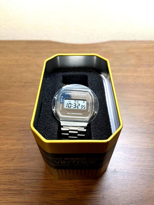 Casio Vintage A168WEM-7VT digital wristwatch in silver with backlight and date display