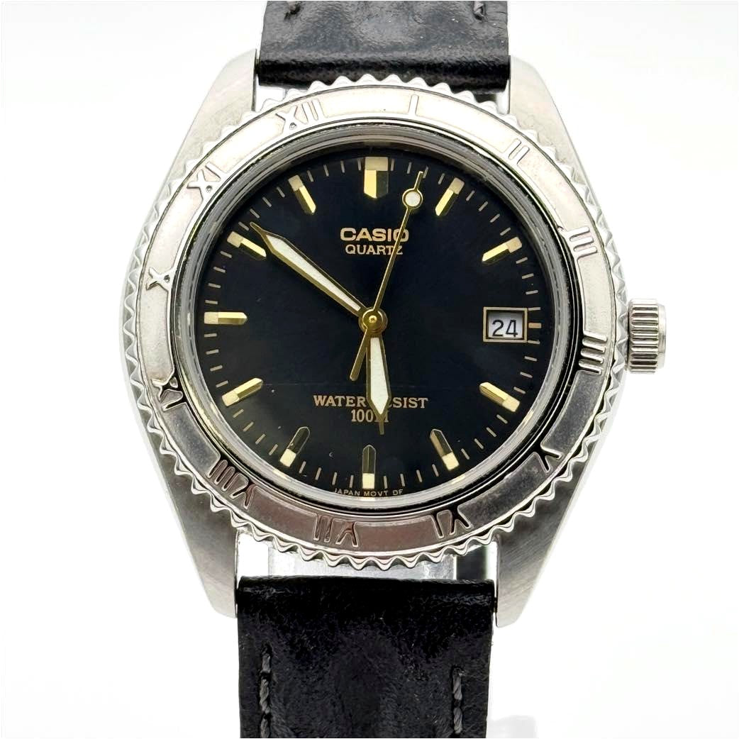 Casio Vintage MTD-1004 analog watch with black dial and silver case, 35mm size