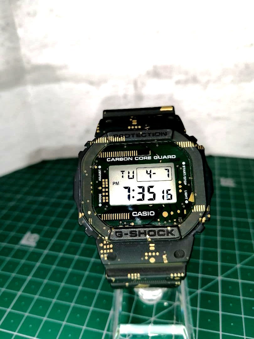 Casio G-Shock DWE-5600CC digital watch with Carbon Core Guard in black, Japan import, shown front view