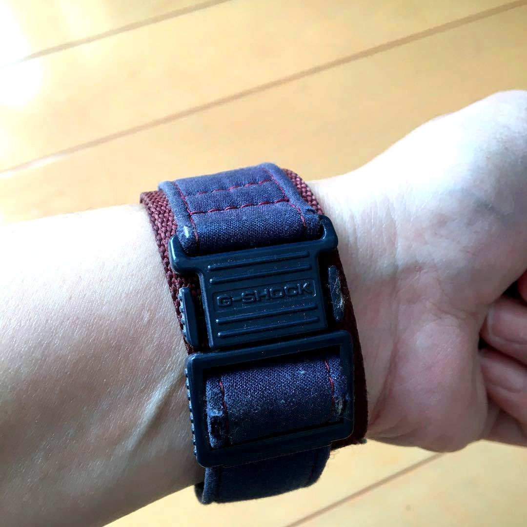 Casio G-Shock watch in rare navy and bordeaux colors with visible signs of use and no working battery