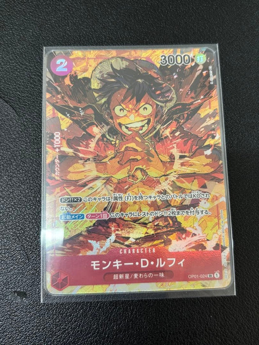 One Piece Monkey D. Luffy trading card model OP01-024 with white scratches on the back corners
