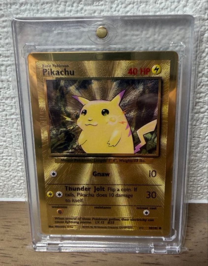 Bandai Pikachu 25th Ultra Premium Metal Collection collectible card with protective inner sleeve and loader