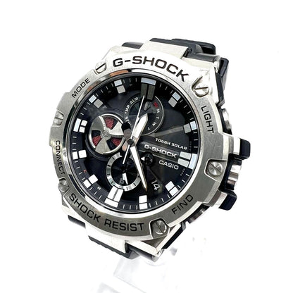 Casio G-Shock GST-B100-1AJF watch with black resin band and mineral glass face featuring Bluetooth connectivity
