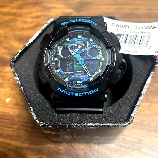 Casio G-Shock GA100CB-1A black blue watch with digital and analog display, battery included, Japan import