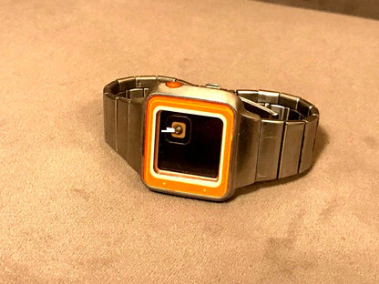 Casio Futurist LAQ-2000D digital wristwatch with silver and orange display and stainless steel band