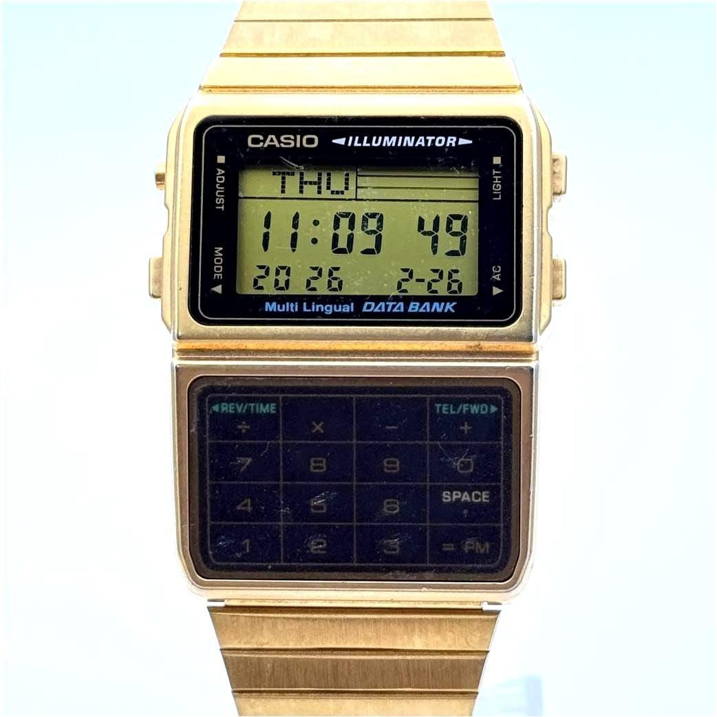 Casio DBC-611G Data Bank wristwatch with gold-tone finish and visible small screen scratches