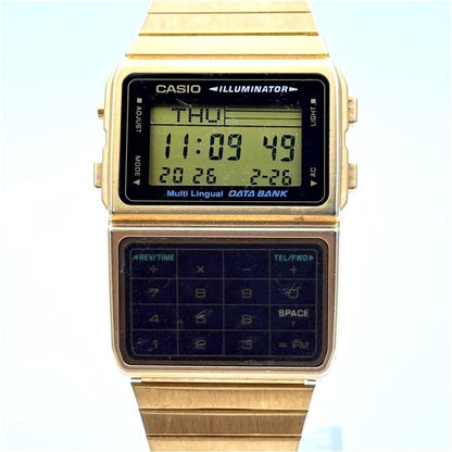 Casio DBC-611G Data Bank wristwatch with gold-tone finish and visible small screen scratches