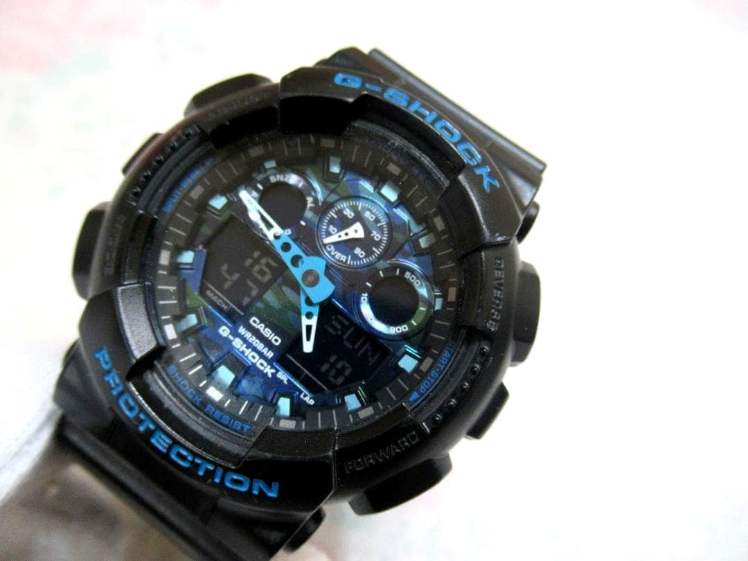 Casio G-Shock GA-100CB-1AJF black and blue quartz watch with a clean band and clear dial