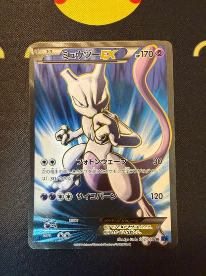 Mewtwo EX SR XY8 Blue Impact trading card number 062/059 with clean front and minor back scratches
