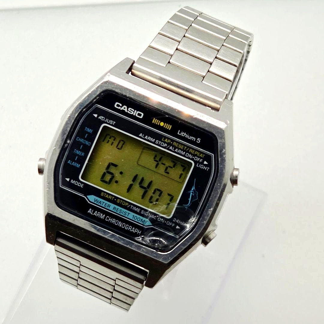 Casio H101 vintage digital chronograph watch with digital display and metal band showing minor wear