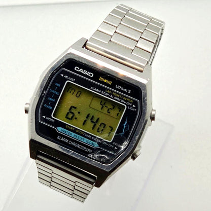Casio H101 vintage digital chronograph watch with digital display and metal band showing minor wear