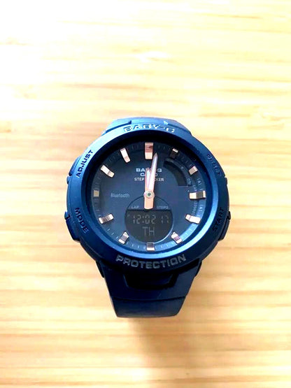 Casio Baby-G BSA-B100-2AJF Bluetooth Step Tracker Watch with black body and pink gold dial
