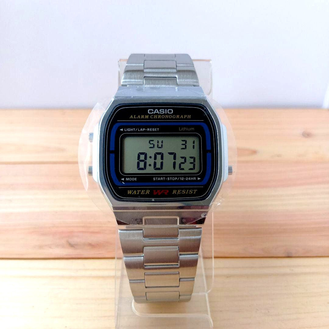 Casio A159WA-N1JH digital watch with metal band showing storage marks