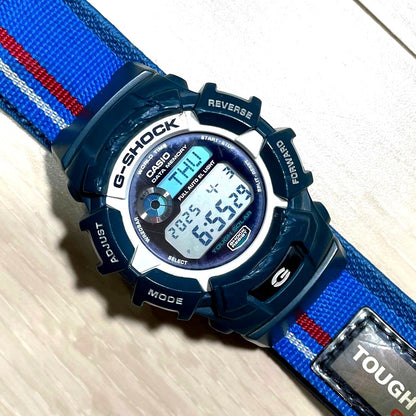 Casio G-Shock Tough Solar Data Memory Watch with white and blue body showing usage wear