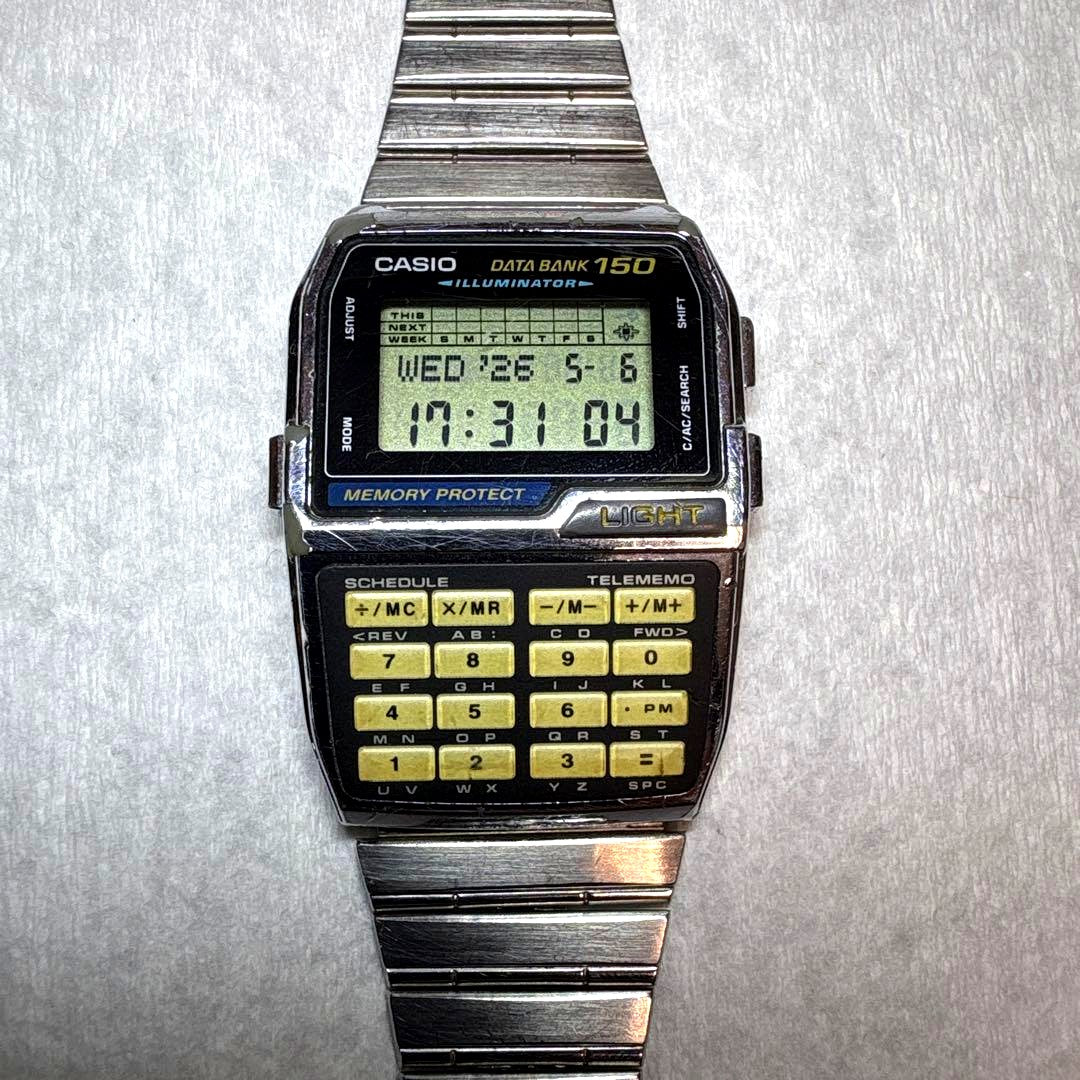 Casio Data Bank DBC-1500 digital calculating watch showing display and keypad with minor signs of use