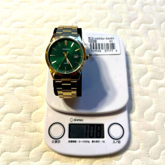 Casio MTP-V036-3AUBF wristwatch with gold case, green dial, and date display, Japan import