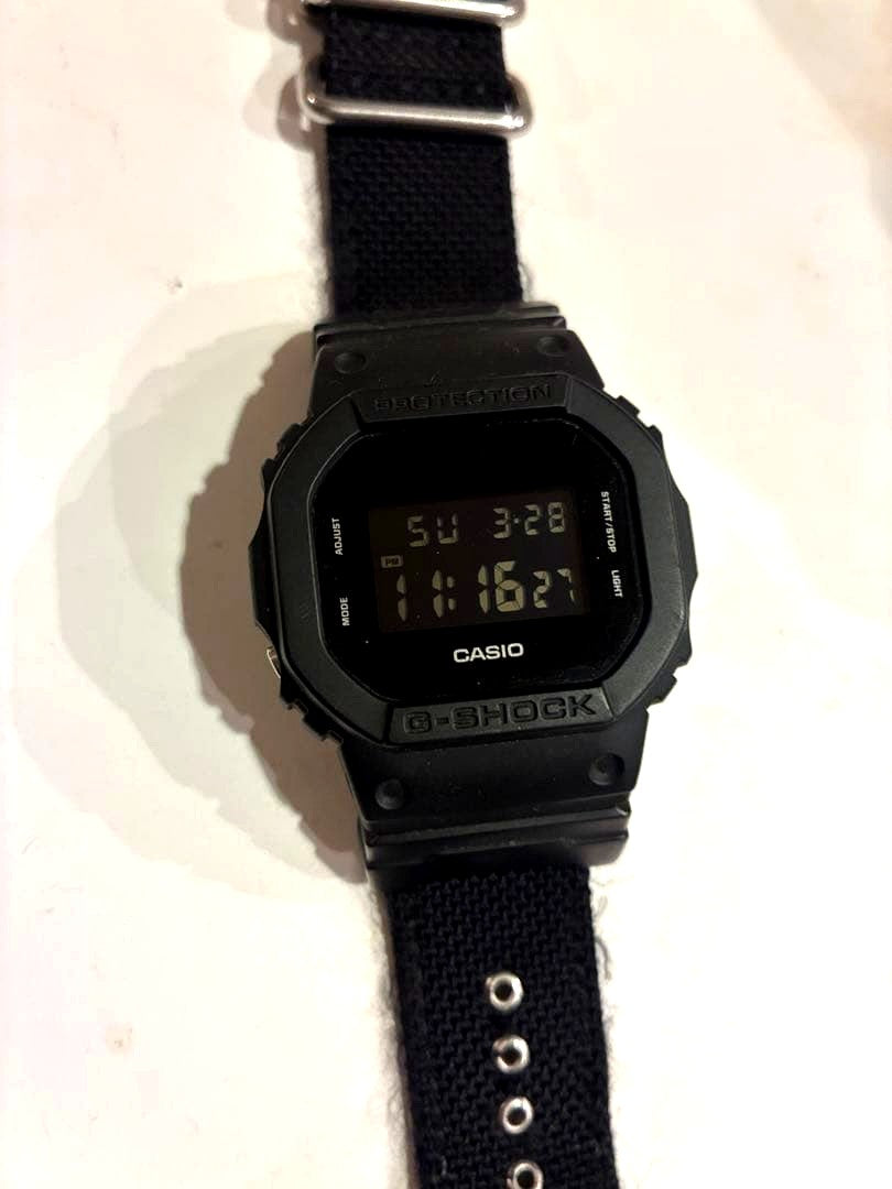 Casio G-Shock DW-5600BBN-1 black digital watch with nylon strap, Japan import, front view