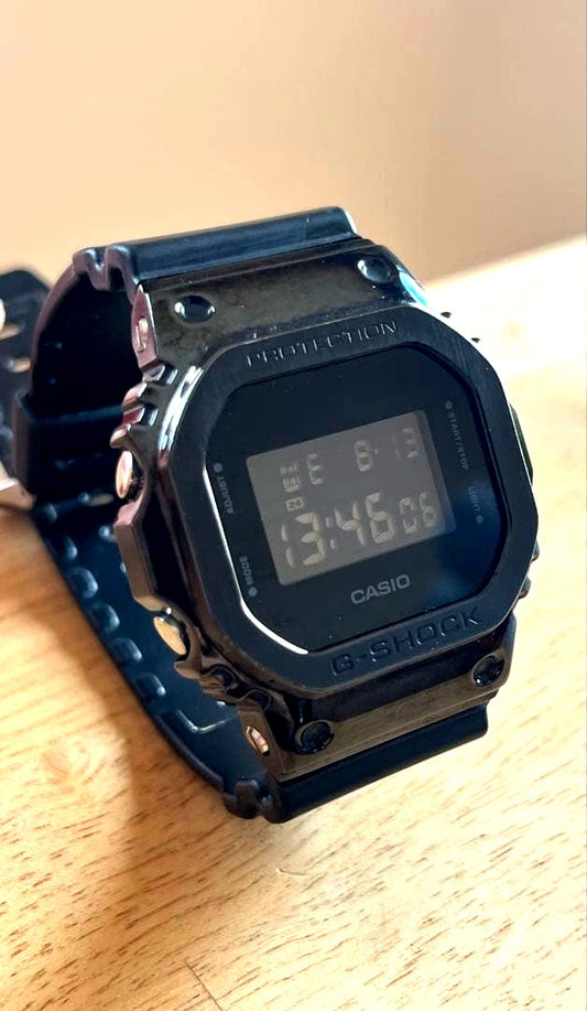 Casio G-Shock black digital wristwatch with shock resistant design, used condition