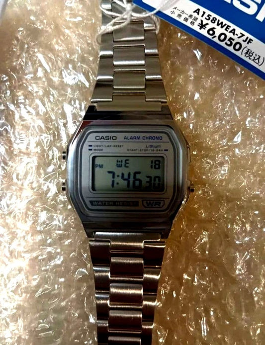 Casio A158WEA-7JF classic digital wristwatch in silver with stainless steel band, new condition, no original box