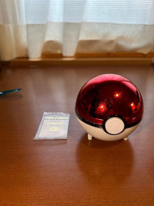 Rare 23K gold-plated Pikachu collectible card from 1999 Burger King US sale with Poké Ball case