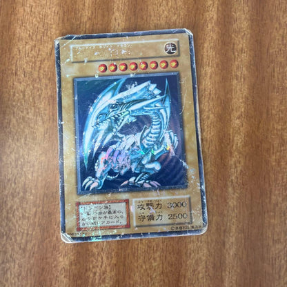 KONAMI Blue-Eyes White Dragon Japanese Yu-Gi-Oh card showing 3000 attack and 2500 defense stats