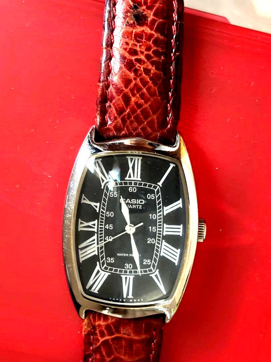 Casio MTP-1208 men's quartz wristwatch with black dial and stainless steel case