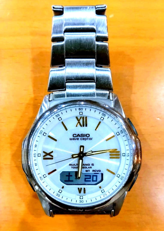 Casio Wave Ceptor Radio Solar Wristwatch model M630 showing analog display and stainless steel band