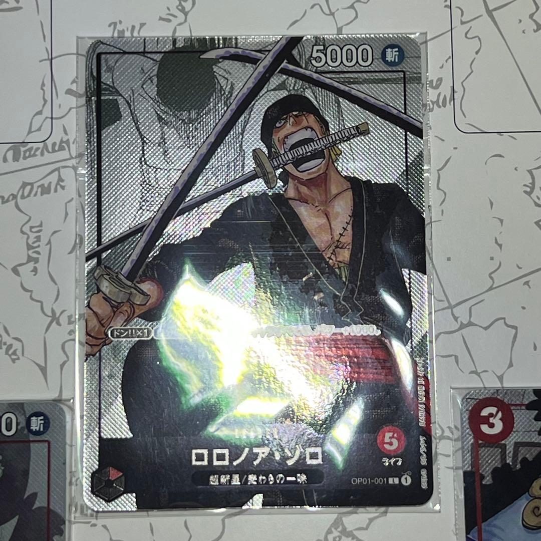 Sealed One Piece Card Game Luffy OP01-001 25th Anniversary promo card with red border and unopened packaging