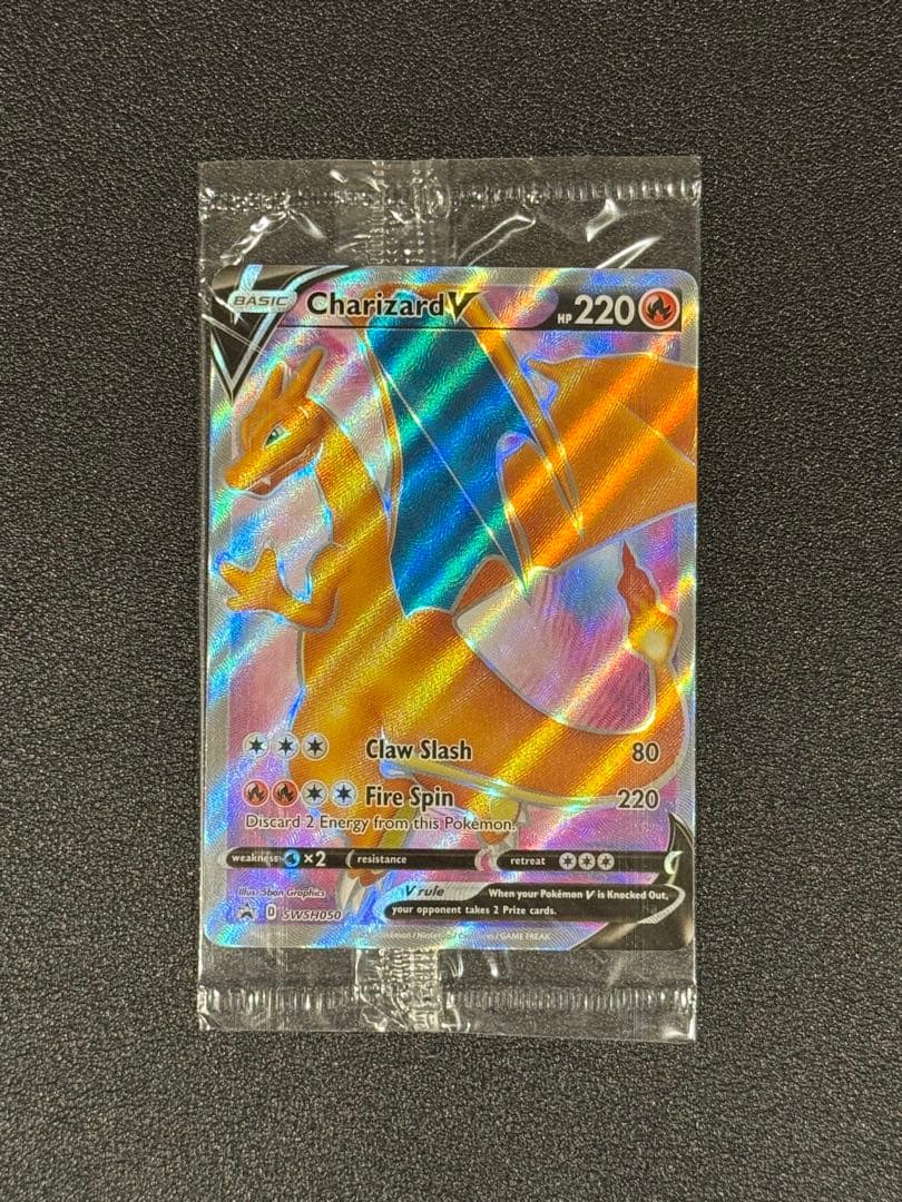 Unopened Charizard V Promo SWSH050 trading card with model number and brand visible