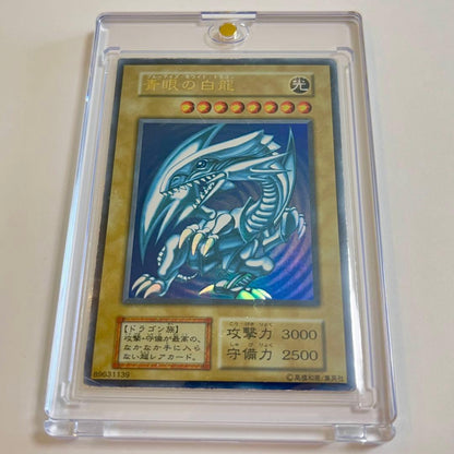 Blue-Eyes White Dragon ultra rare trading card from early Japanese starter box collection in protective sleeve and loader