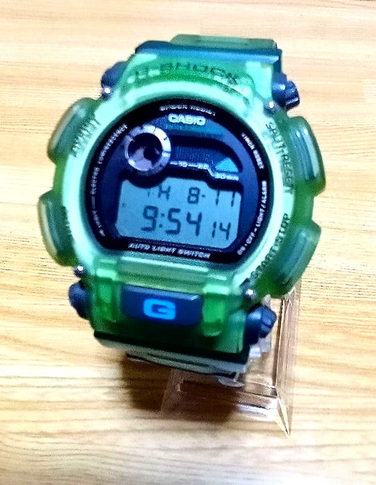 Used Casio G-Shock green quartz watch with green resin silicone band and miscellaneous dial shape