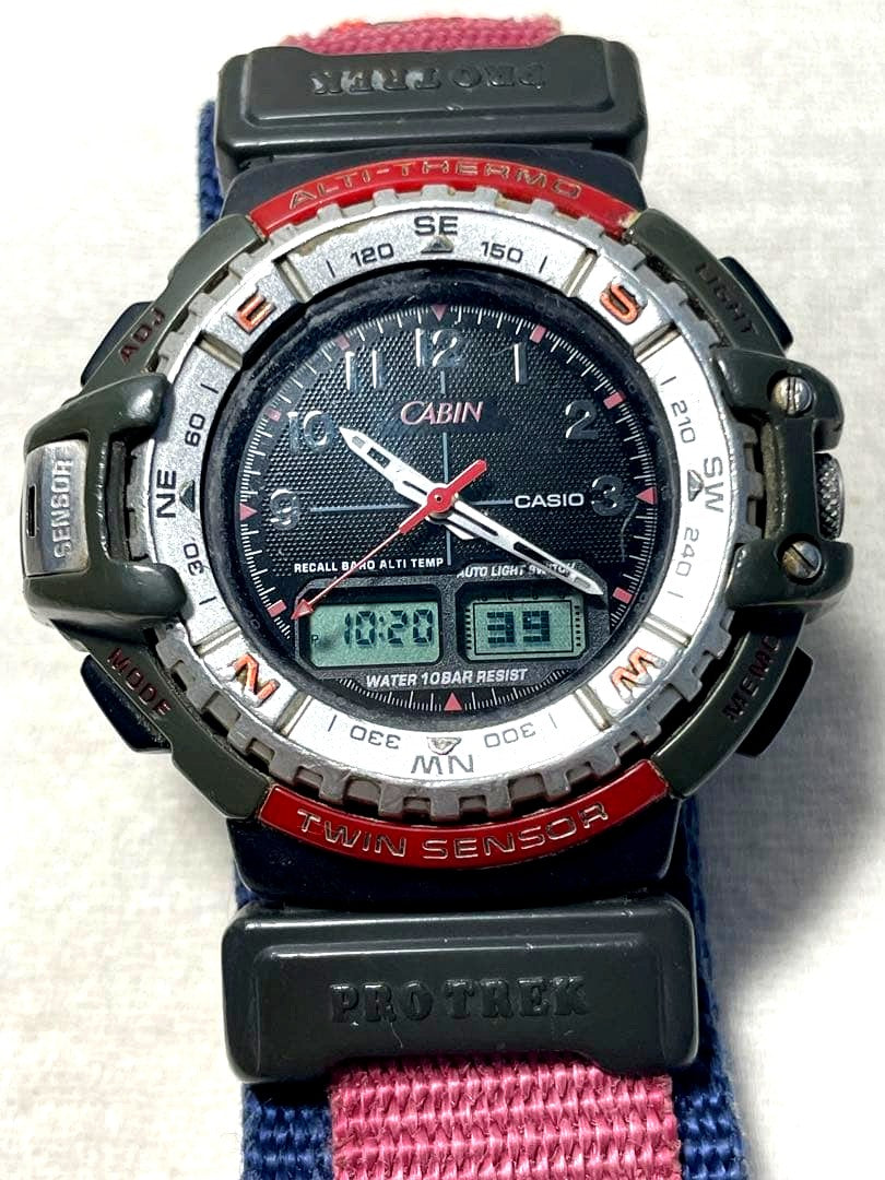 Casio Protrek Cabin PRT-70 model watch showing dial, buttons, and worn case with backlight feature
