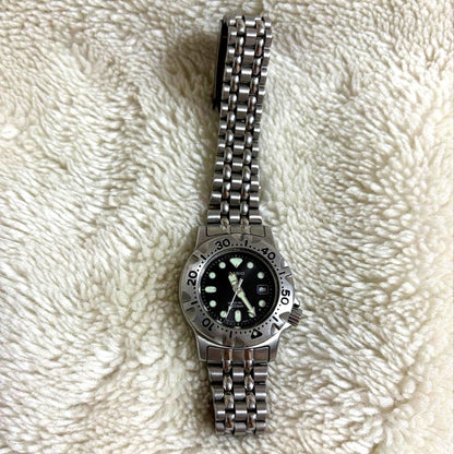 Vintage Casio wristwatch showing scratches and signs of wear on the face and band